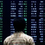 تذبذب الأسواق الآسيوية مع تراجع النفط وصعود الدولار
